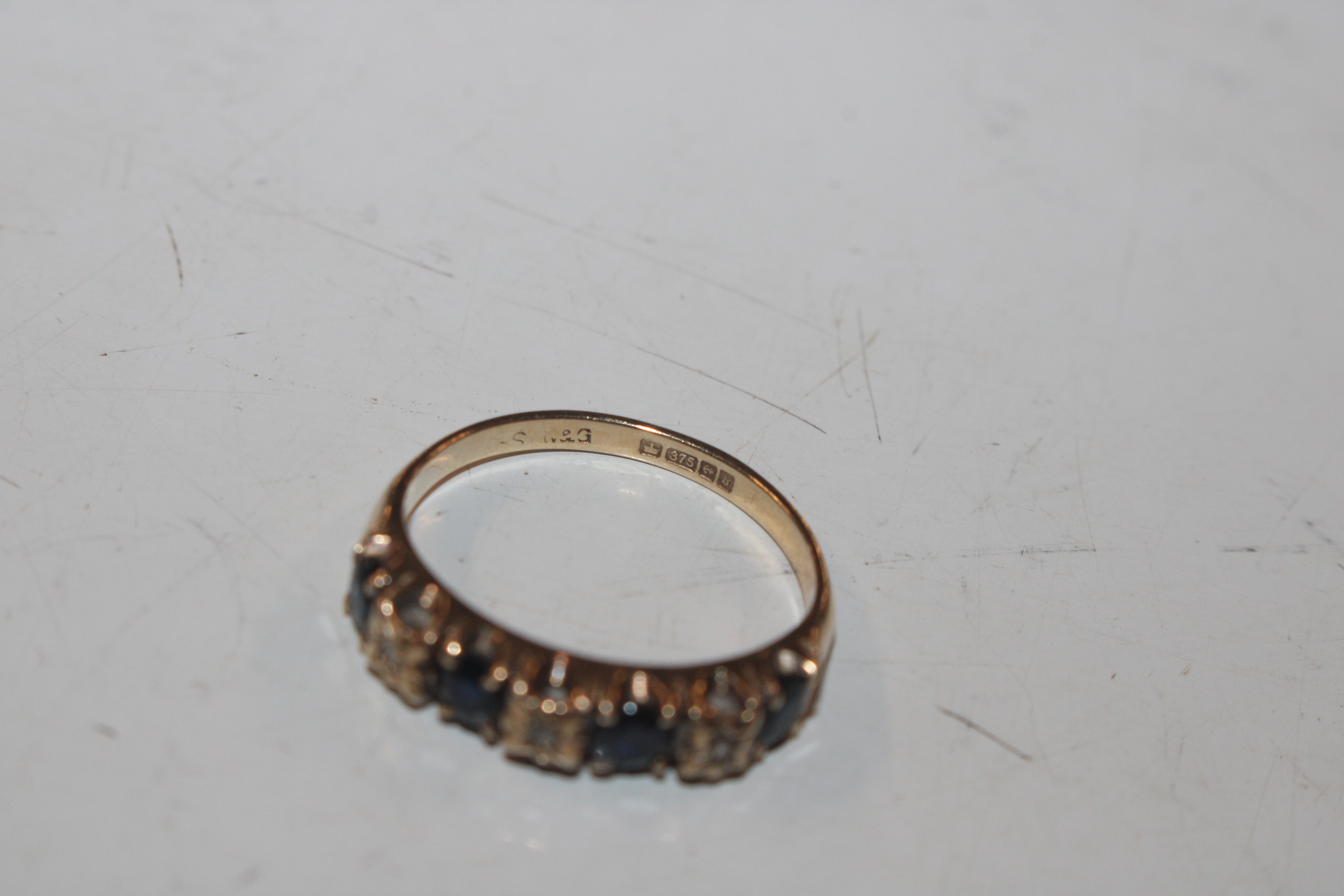 A 9ct gold half eternity ring set with chip diamon - Image 5 of 10