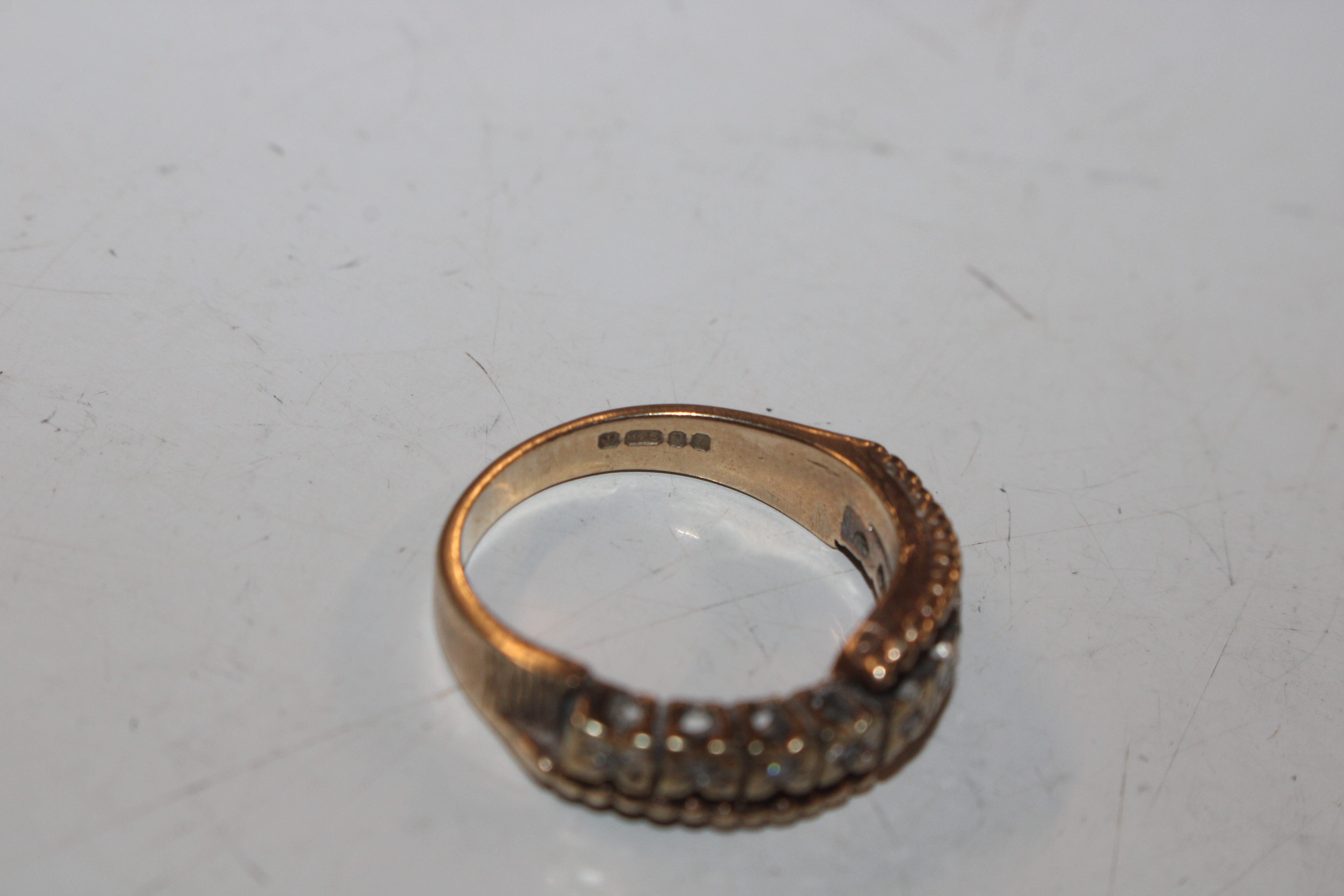 A 9ct gold half eternity ring set with chip diamon - Image 9 of 10