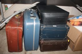 A collection of miscellaneous suitcases