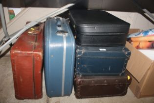 A collection of miscellaneous suitcases