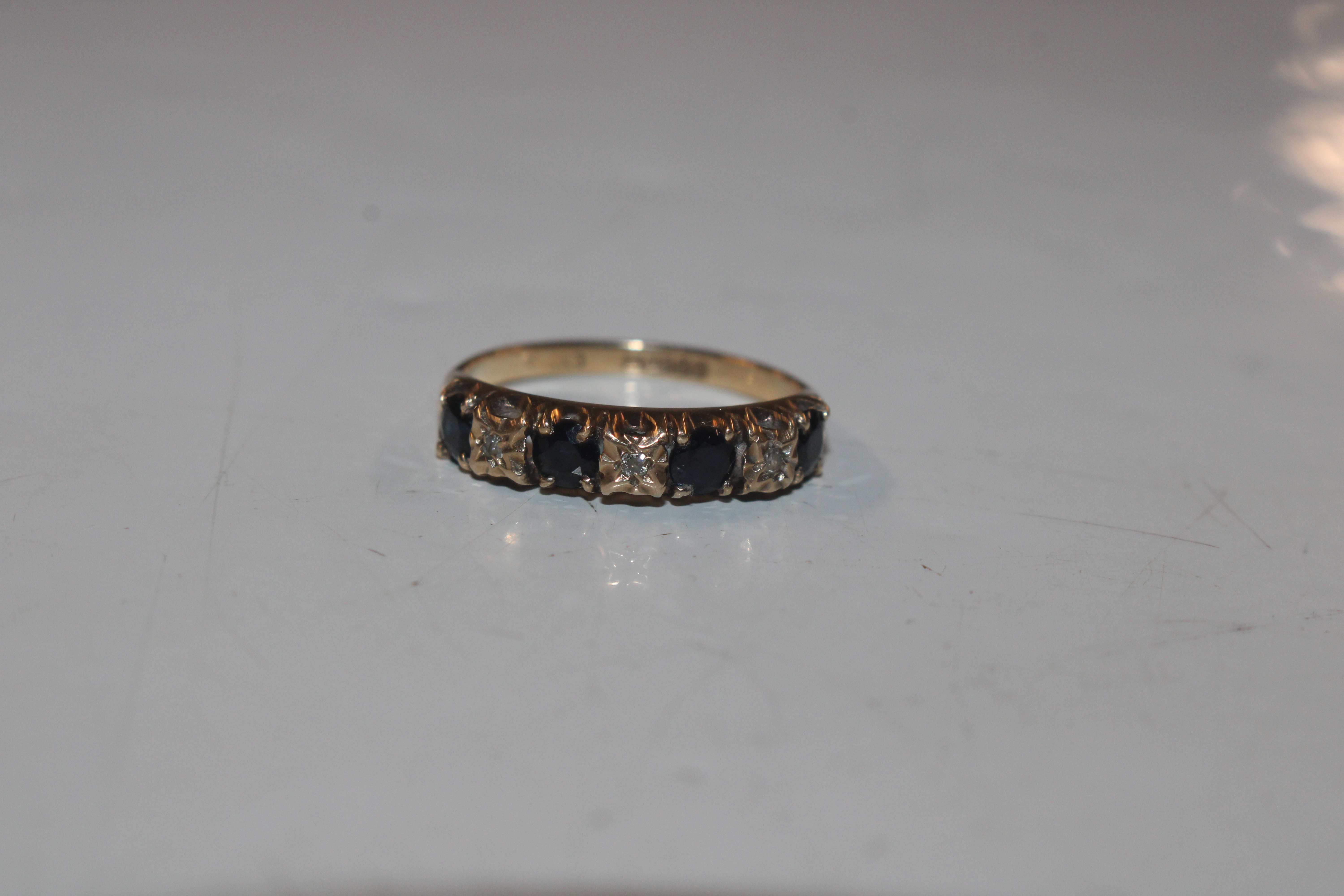 A 9ct gold half eternity ring set with chip diamon - Image 3 of 10