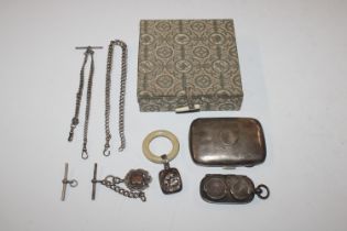 A silver watch chain; another watch chain; a fob;