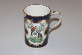 A Worcester mug, hand painted with birds and butte
