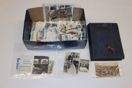 A box containing stamps, post-cards, an album of c