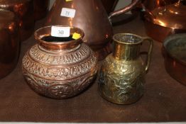 A Eastern copper vase and a small brass jug with f