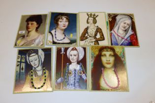 Seven necklaces mounted to boards decorated with p