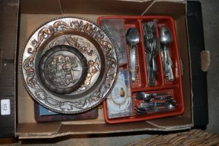 A box of miscellaneous cutlery and metal ware