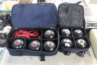 A bowling bag containing four Almark bowling woods