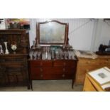 A wooden dressing table with swing back mirror fit