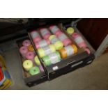 A large quantity of various coloured yarn rolls (a