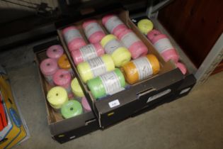 A large quantity of various coloured yarn rolls (a