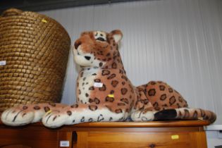 A large cuddly toy in the form of a leopard