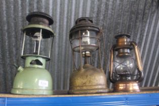Three various hanging oil lamps (one AF)