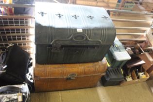 Two metal dome topped travelling trunks with twin