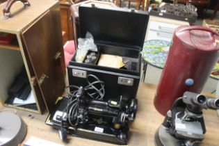 A Singer sewing machine and carrying case, sold as