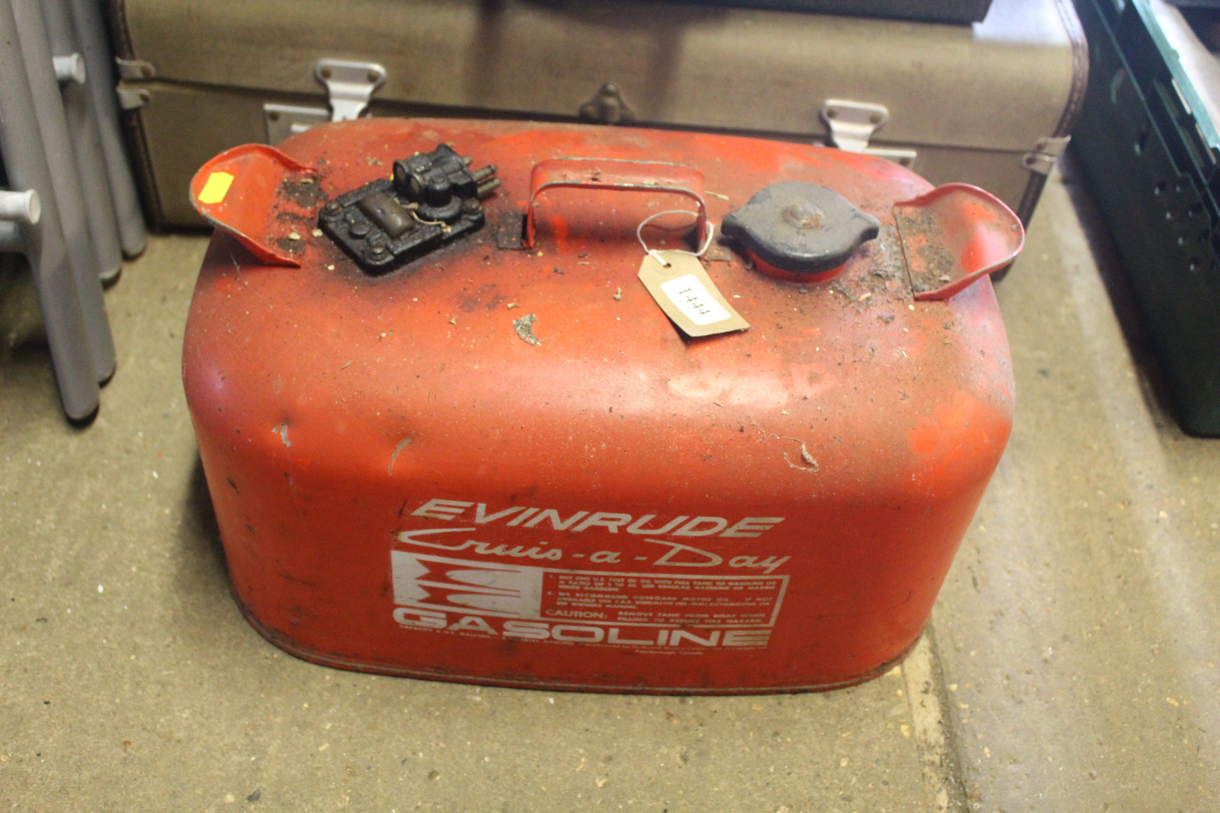 An Evinrude boat fuel five gallon can with content