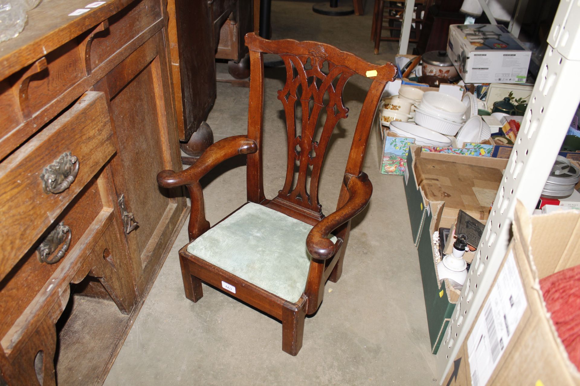 A Chippendale style child's armchair with green up