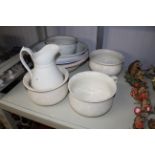 A quantity of large china bowls, jug and three cha