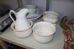 A quantity of large china bowls, jug and three cha