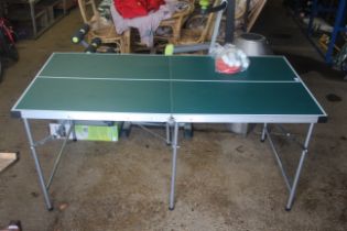 A folding table tennis table, approx. 30½" wide x