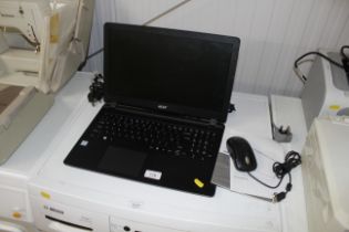 An Acer EX2540-33WP laptop with charger, mouse and instruction guide password unknown