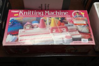 A Tomy knitting machine with original box