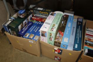 Two boxes of various board games, jigsaws etc