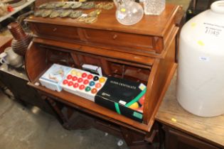 A mahogany roll top desk