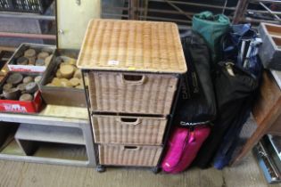 A wicker three drawer storage unit