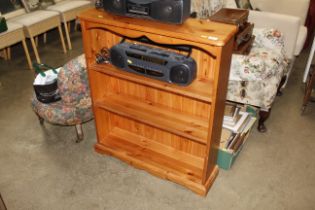 A small three shelf pine bookcase