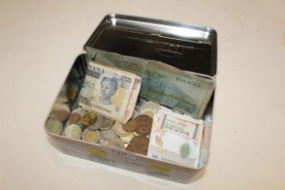 A metal box containing various foreign bank notes,