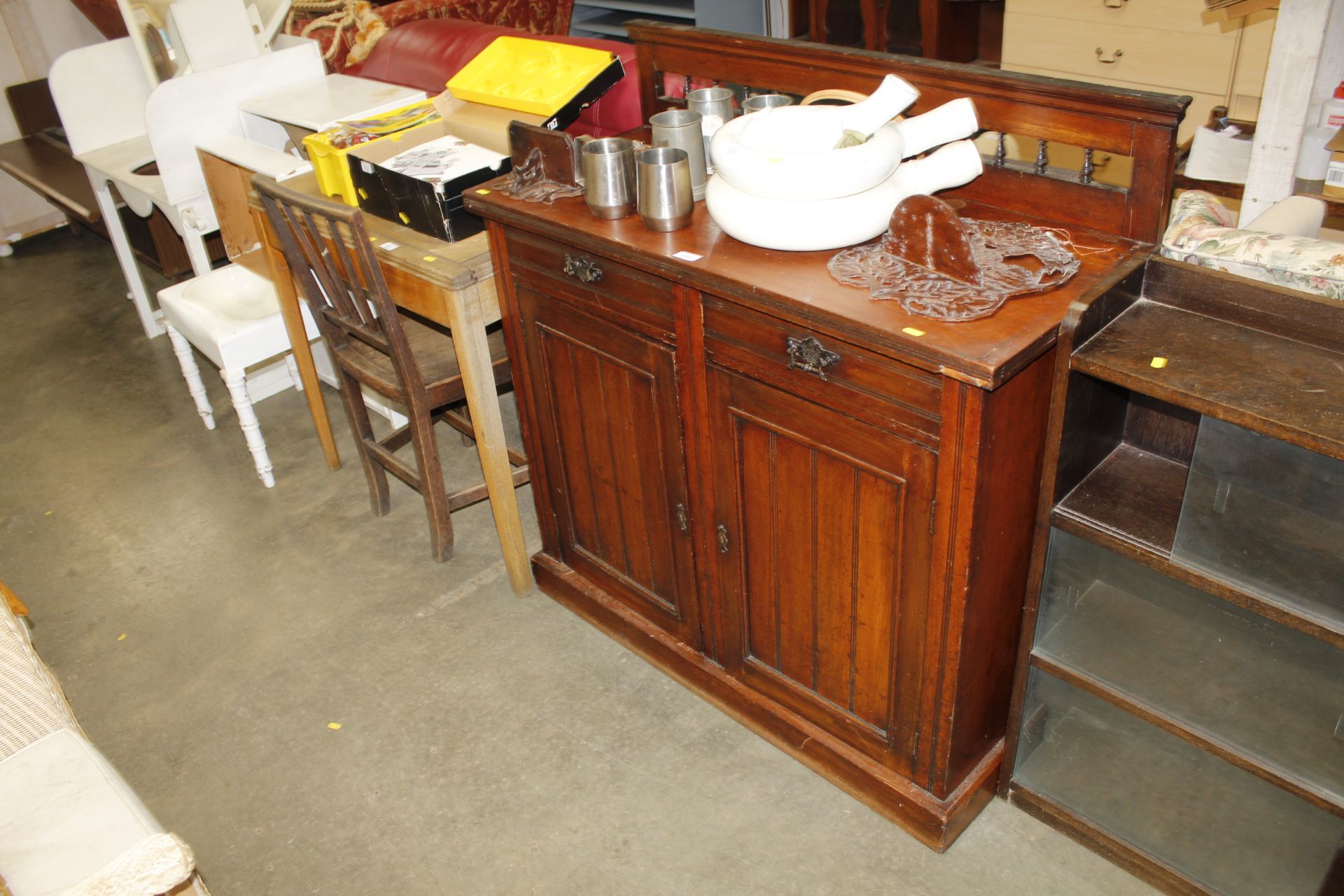 A sideboard with raised back fitted two short over