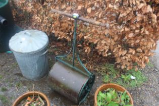 An ornate cast iron garden roller