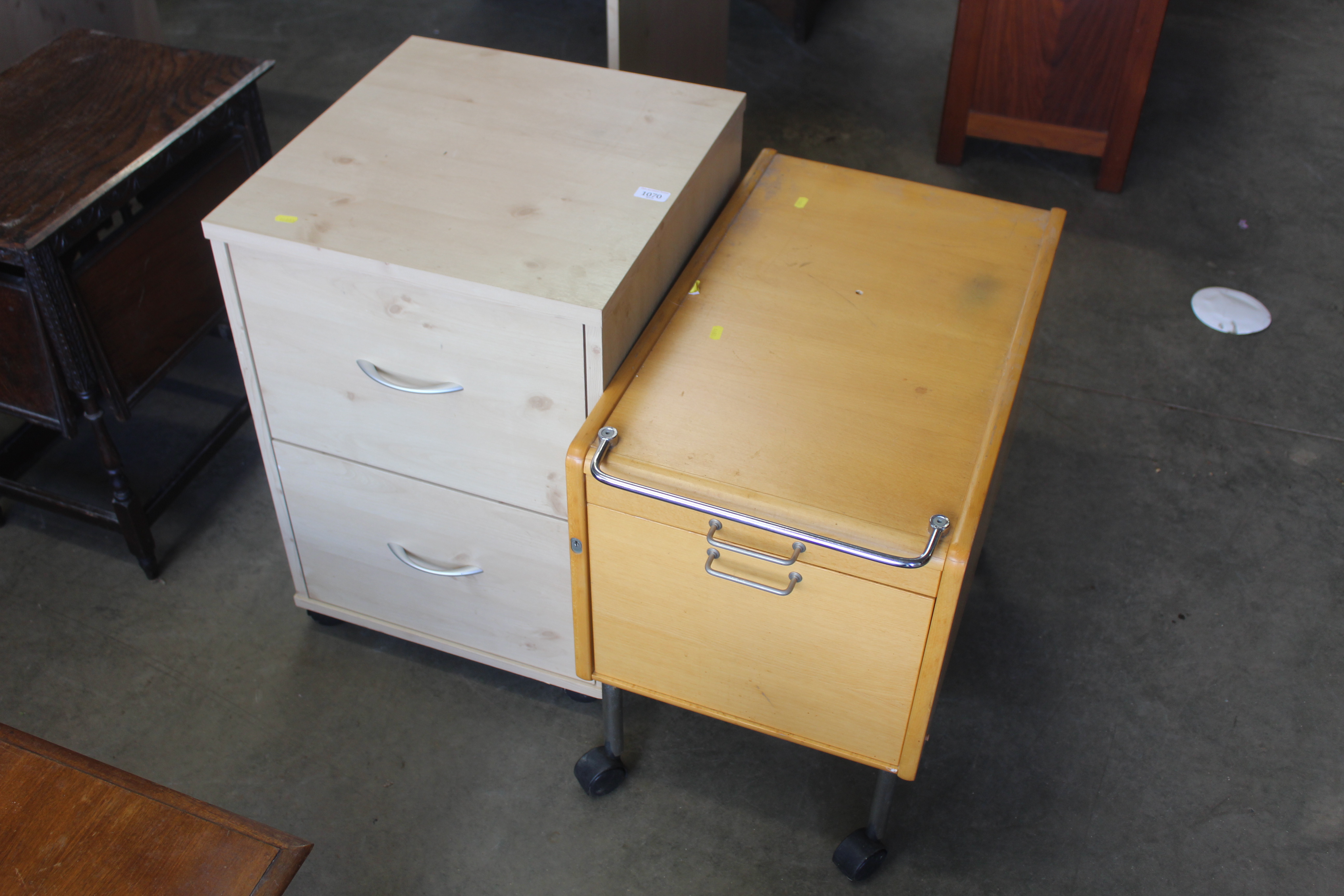 A modern two drawer filing cabinet and one other