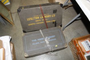 Two cardboard laundry boxes named to Leighton laun