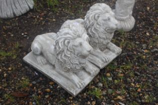 A pair of cast concrete garden statues in the form
