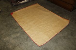 An approx. 6" x 4'7" brown mat with brass eyelets