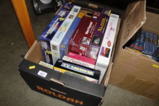 A box of various board games, puzzles etc. - some