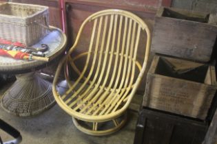 A bamboo armchair (lacking cushions)