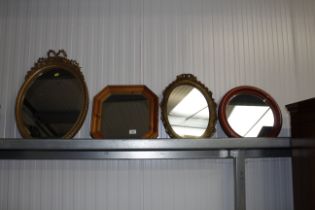 Four various framed wall mirrors