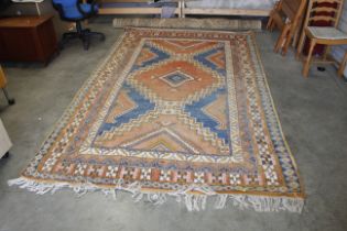 An approx. 10'9" x 6'7" blue/red eastern patterned