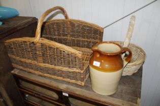 A partly glazed stoneware jar with handle and pour