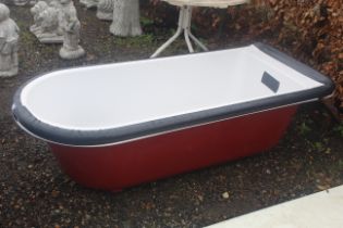 A roll top bath with ornate chrome feet (dis-assem