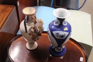 An Oriental blue and white vase with double ring m