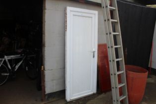 A UPVC door and frame measuring approx. 31½" wide