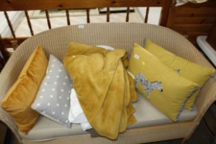 A quantity of various pillows, cushions, blankets