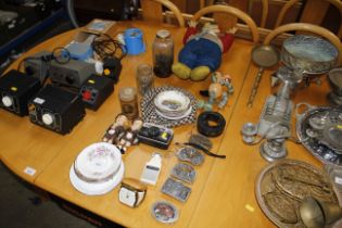 A travellers clock; novelty belt buckles for Budwe