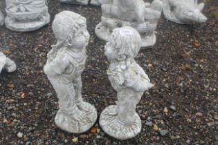 Two cast concrete garden statues in the form of Ja