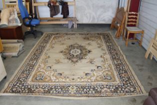 An approx. 10'8" x 7'10" brown/ black patterned rug AF