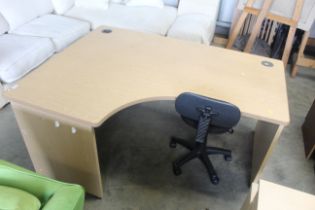 A beech effect office desk and office swivel chair